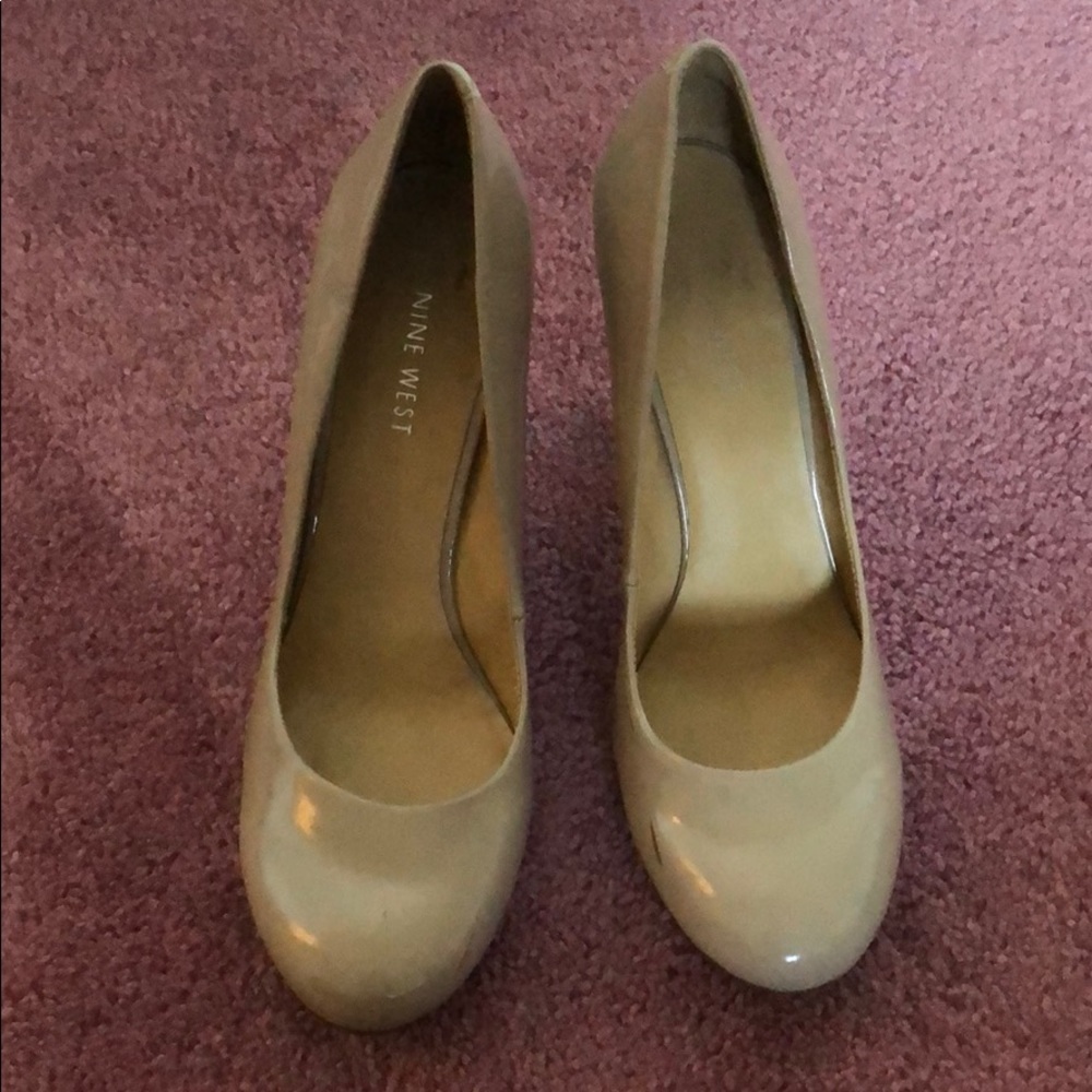 Tan heels. scuffs on the front. rounded toe